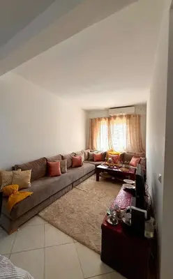a living room with a couch and a table at Marrakech stay in Marrakech