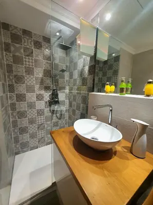 a bathroom with a white sink and a shower at Peaceful one terrace suite, gueliz in Marrakech