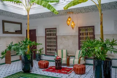 a room with a table with potted plants on it at Riad les palmiers de la medina in Marrakech