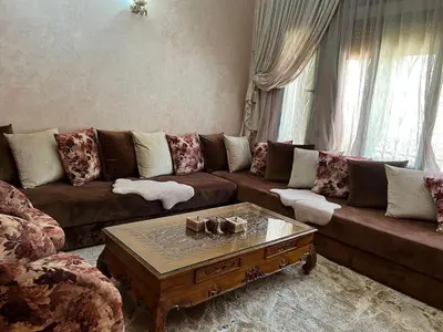 a living room with a couch and a coffee table at Villa in Marrakesh Targa with swimmingpool in Marrakech