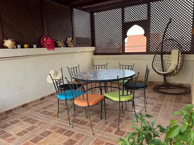 a table and chairs sitting on a patio at Villa in Marrakesh Targa with swimmingpool in Marrakech