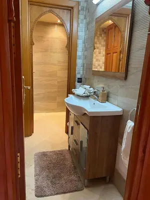 a bathroom with a sink and a mirror at Villa in Marrakesh Targa with swimmingpool in Marrakech