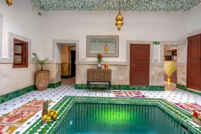 a swimming pool in a room with at Riad Jowara in Marrakech