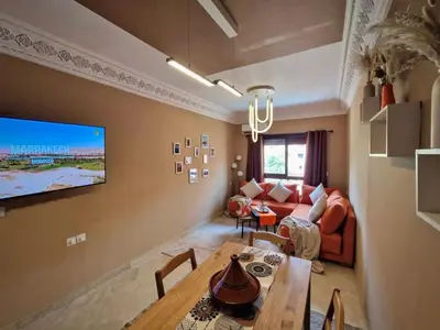 a living room with a couch and a table at Appartement cosy au cœur de la medina in Marrakech