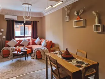 a living room with a couch and a table at Appartement cosy au cœur de la medina in Marrakech