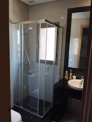 a bathroom with a shower and a sink at Appartement prestigia golf in Marrakech