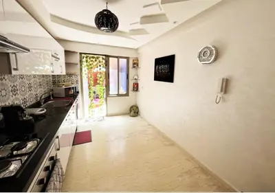 a kitchen with a sink and a counter top at duplex prestige Gueliz in Marrakech