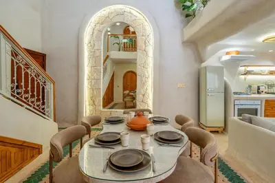 a dining room with a table and chairs at DarNiama - 3 Suites & Private Pool - Gueliz Center in Marrakech