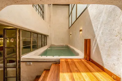a swimming pool in the middle of a building at DarNiama - 3 Suites & Private Pool - Gueliz Center in Marrakech