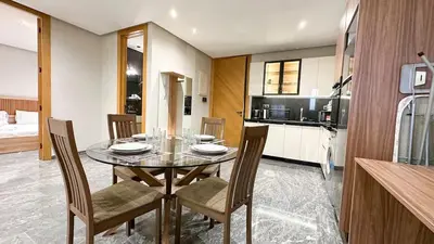 a kitchen and dining room with a table and chairs at Le Cocon 28 Spacieux & Stylé au Cœur de la Ville in Marrakech