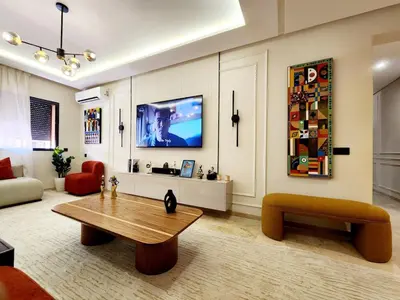a living room with a couch and a coffee table at Bohemian Chic Apartment in Guéliz - Pool View in Marrakech