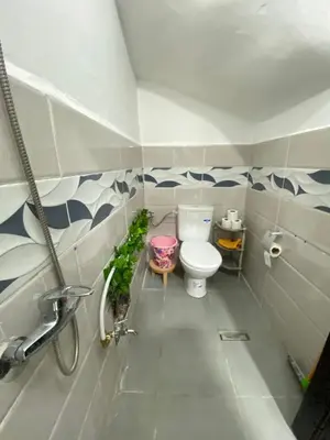 a bathroom with a toilet and a sink at Cosy, Calm Apartment - Wi-Fi, AC & NETFLIX in Marrakech