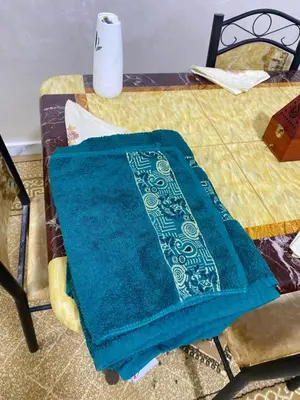 a blue towel is sitting on a table at Cosy, Calm Apartment - Wi-Fi, AC & NETFLIX in Marrakech