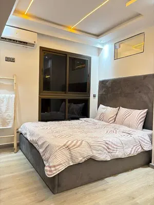 a bedroom with a large bed in a room at Apartment with pool in Marrakech