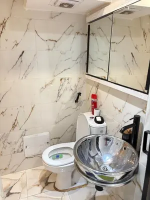 a bathroom with a sink and a toilet at Apartment with pool in Marrakech