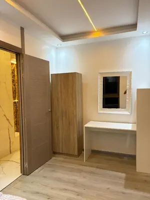 a bathroom with a cabinet and a mirror on the wall at Apartment with pool in Marrakech