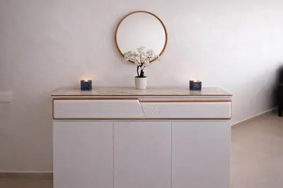 a dressing table with two candles and a mirror at Marrakech prestige in Marrakech