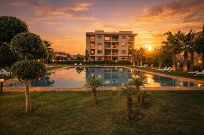 a hotel with a pool in front of a building at Marrakech prestige in Marrakech