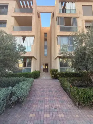 a building with a brick walkway in front of it at Marrakech prestige in Marrakech