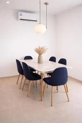a dining room with a table and chairs at Marrakech prestige in Marrakech
