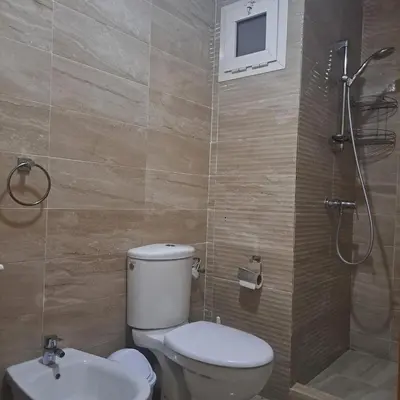 a bathroom with a toilet and a sink and a shower at Luxury 2 Bedrooms Apartment in Marrakech