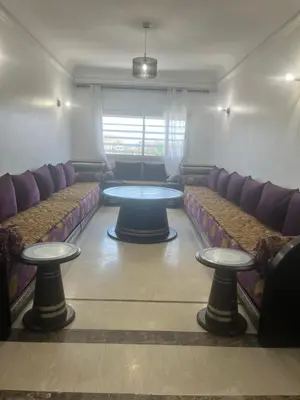 a waiting room with couches and tables in a room at Prestigieux Appart hivernage in Marrakech