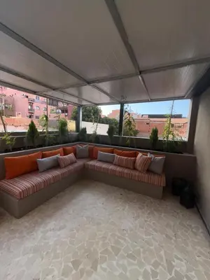 a living room with a couch under a tent at Appartement de luxe à gueliz neuf et moderne in Marrakech