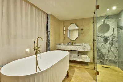 a bathroom with a tub and a sink at Zen Zone Boutique Riad & Spa in Marrakech