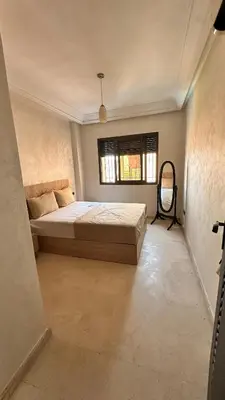 a bedroom with a bed and a window at Sofia Palmeraie - High standing in Marrakech