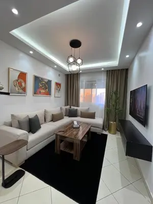a living room with a couch and a coffee table at Peaceful Marrakech Stay Cozy Well Located in Marrakech