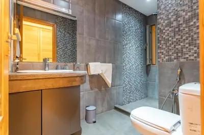 a bathroom with a sink and a toilet at Villa Meraki in Marrakech