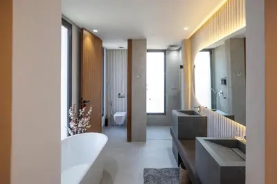 a bathroom with two sinks and a tub at Villa Tiaré Luxury, pool, staff and private cinema in Marrakech