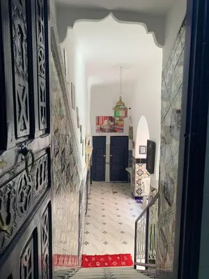 an entrance to a hallway with a tile floor at Riad Zifamo in Marrakech