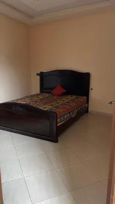 a large bed in a room with at Marrakech,Massira1 in Marrakech
