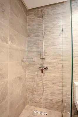 a shower with a glass door in a bathroom at Villa Aria Marrakech in Marrakech
