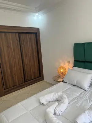 a bedroom with a bed with a pillow on it at Super apt plein centre de Gueliz hyper bien placer pour votre séjour tout à proximité resto café transport in Marrakech