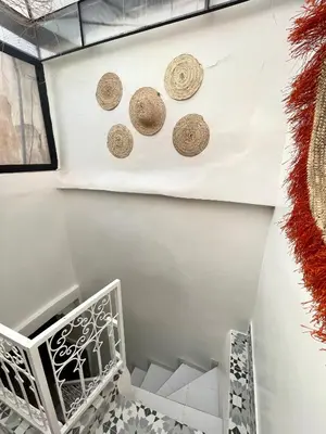 a wall with three cork plates on the wall at Dar Salomi in Marrakech