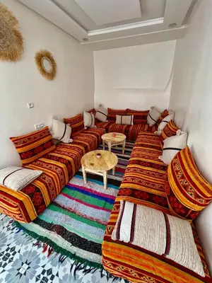 a living room with couches and a table at Dar Salomi in Marrakech