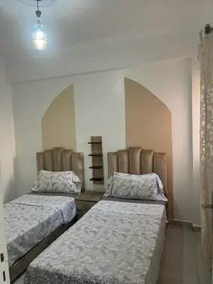 a bedroom with two beds in a room at appartement sadaa in Marrakech