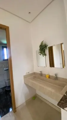 a bathroom with a sink and a mirror at VILLA MARRAKECH - Centre Ville in Marrakech