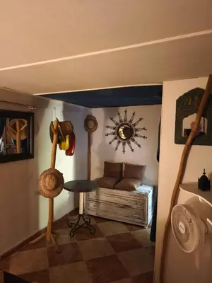 a room with a bed and a table in a room at maison Noé , chambre au rez de chaussée ,un lit double, sale de bain privative séparer in Marrakech