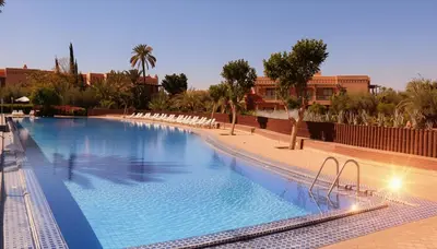 a large swimming pool in a resort at Palmeraie Stay - Pool & Lake in Marrakech