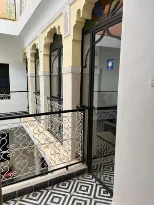 an open door to a balcony in a building at Riad Miliana in Marrakech