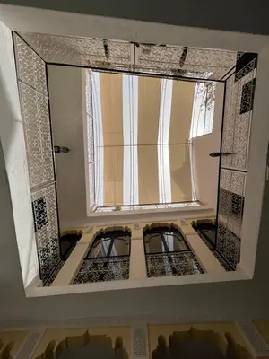 a view of a room with a window in the ceiling at Riad Miliana in Marrakech