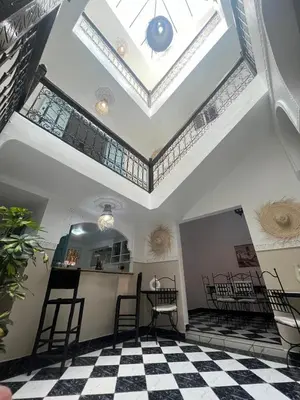 a room with a ceiling with a checkered floor at RIAD Al QARYA 4 chambres in Marrakech