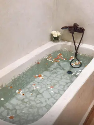 a bath tub filled with lots of trash at Riad Baba in Marrakech
