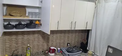 a kitchen counter with white cabinets and a sink at Cozy Duplex in downtown Marrakesh- 7mn from Gueliz in Marrakech