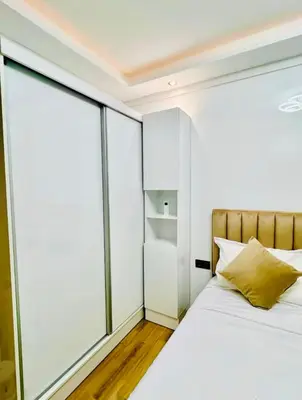 a bedroom with a bed and glass walls at Appart Duplex 3ch Piscine in Marrakech