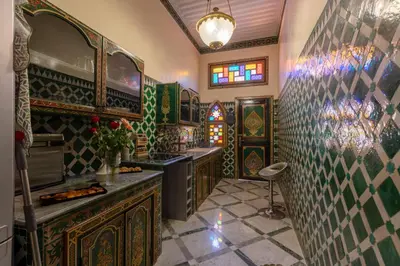 a kitchen with a sink and a counter top at L Mansion Villa in Najem
