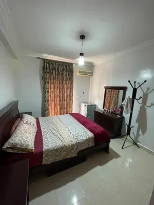 a bedroom with a bed and a dresser and a mirror at Spacious 2 bedroom apartment 6 people 5 min from Marrakech center in Marrakech